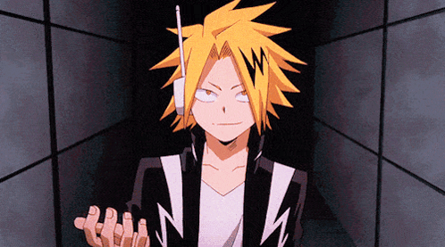 A Cartoon Character With Yellow Hair And A Lightning Bolt On His Head Is Standing In A Dark Room . GIF