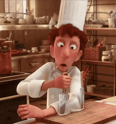 A Cartoon Chef Is Holding A Knife And A Spoon In A Kitchen GIF