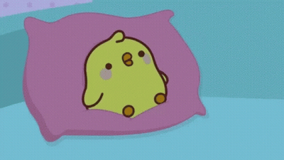 A Cartoon Chicken Is Sleeping In A Bed With A Blanket On It . GIF