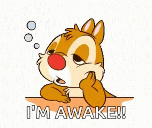 A Cartoon Chipmunk Sitting At A Table With The Words `` I 'M Awake '' Written On It . GIF