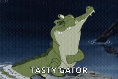 A Cartoon Crocodile Is Standing On A Rock With Its Mouth Open And The Words Tasty Gator Behind It . GIF