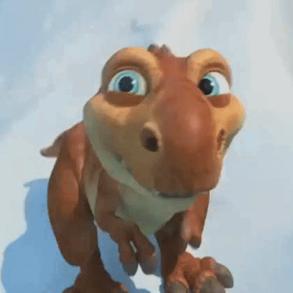 A Cartoon Dinosaur Is Walking On A Snowy Surface . GIF