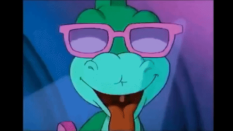 A Cartoon Dinosaur Wearing Pink Glasses Is Smiling And Sticking Out Its Tongue . GIF