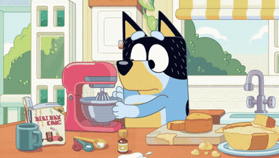 A Cartoon Dog Is Mixing Something In A Mixer With A Box Of Millway Cake Mix GIF