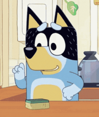 A Cartoon Dog Is Sitting At A Kitchen Counter With A Sponge . GIF
