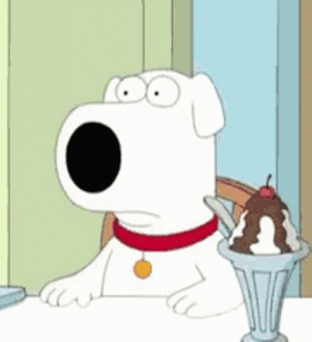 A Cartoon Dog Is Sitting At A Table Next To A Cup Of Ice Cream . GIF