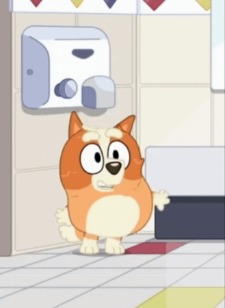 A Cartoon Dog Is Standing In A Bathroom Next To A Hand Dryer . GIF