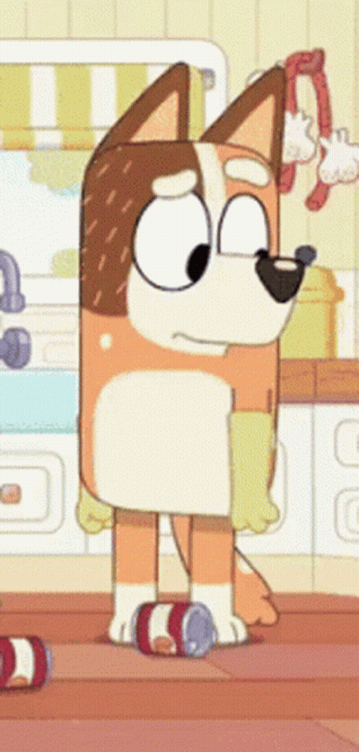 A Cartoon Dog Is Standing In A Kitchen Next To A Can Of Soda . GIF