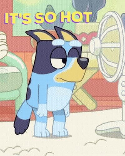 A Cartoon Dog Is Standing In Front Of A Fan With The Words `` It 'S So Hot '' Written On It . GIF