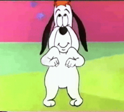 A Cartoon Dog With A Crown On His Head Is Standing On A Green Field And Smiling . GIF