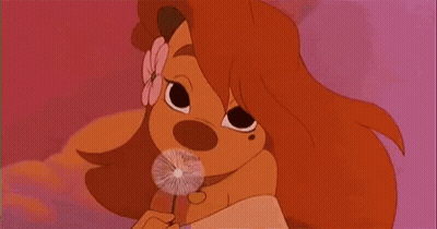 A Cartoon Dog With A Flower In Her Hair Is Blowing Dandelions In The Air . GIF