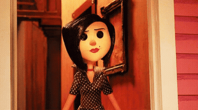 A Cartoon Doll Is Standing In A Doorway With A Picture On The Wall . GIF