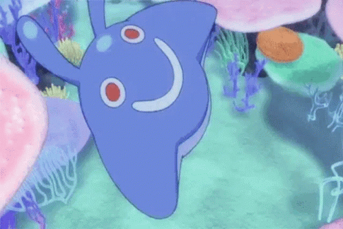 A Cartoon Dolphin Is Swimming In The Ocean With Corals . GIF