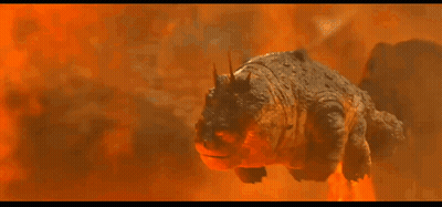 A Cartoon Dragon Is Flying Through The Air In Front Of A Mountain GIF