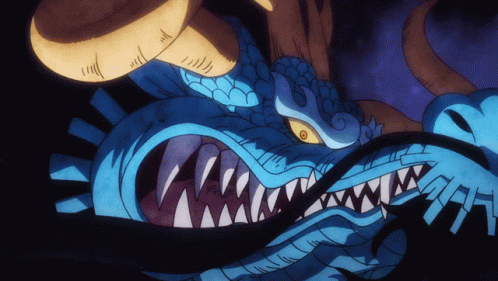A Cartoon Drawing Of A Blue Dragon With Sharp Teeth GIF