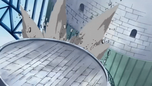 A Cartoon Drawing Of A Brick Wall With A Circular Object In The Foreground GIF