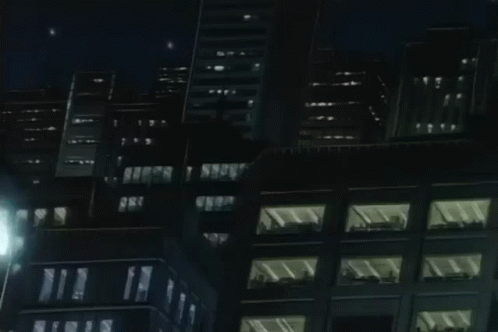 A Cartoon Drawing Of A City At Night With A Yellow Light In The Middle . GIF