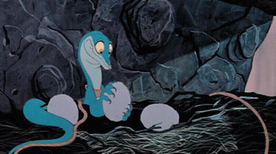 A Cartoon Drawing Of A Snake Laying Eggs GIF