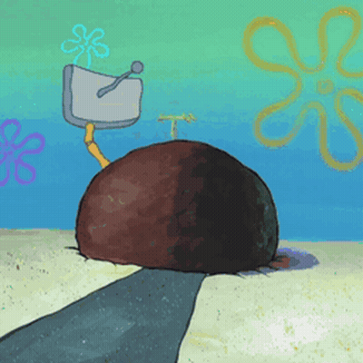 A Cartoon Drawing Of A Spongebob Squarepants Scene With A Large Rock In The Sand GIF