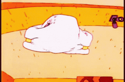 A Cartoon Drawing Of A White Pillow With Gold Rings GIF