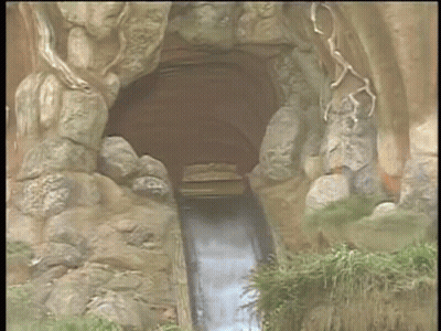 A Cartoon Drawing Of A Zip Ride Going Through A Cave GIF