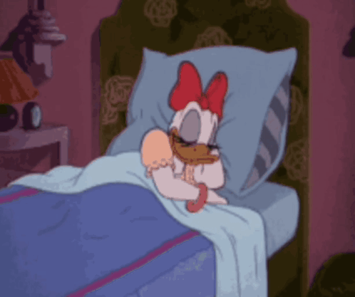 A Cartoon Drawing Of Daisy Duck Laying In Bed GIF