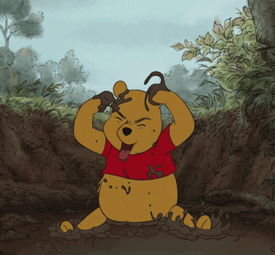 A Cartoon Drawing Of Winnie The Pooh Playing In The Dirt GIF