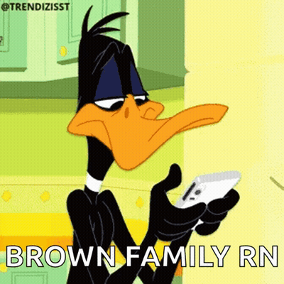 A Cartoon Duck Is Holding A Cell Phone With The Words Brown Family Rn Below It GIF