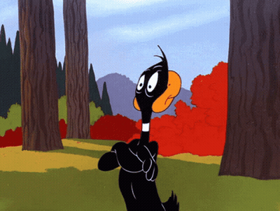 A Cartoon Duck Is Standing In A Forest GIF