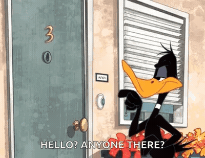 A Cartoon Duck Is Standing In Front Of A Door Talking To Anyone . GIF