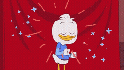 A Cartoon Duck Is Standing In Front Of A Red Curtain Surrounded By Stars . GIF