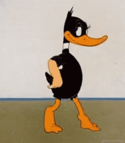 A Cartoon Duck Is Standing In Front Of A Wall Without A Shirt On . GIF
