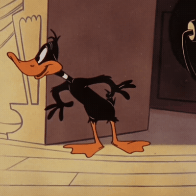 A Cartoon Duck Is Standing Next To A Wall GIF