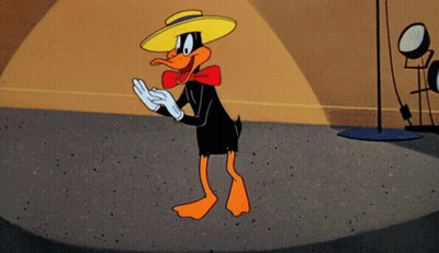 A Cartoon Duck Wearing A Yellow Hat And Gloves GIF