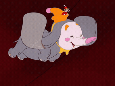A Cartoon Elephant Is Flying Through The Air With A Mouse On Its Back GIF