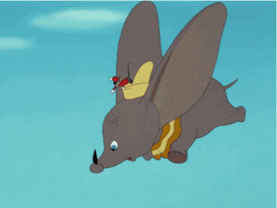 A Cartoon Elephant Is Flying Through The Air With Mickey Mouse Riding On Its Back GIF