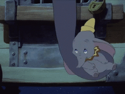 A Cartoon Elephant Is Hanging From A Trunk With A Lock On It GIF