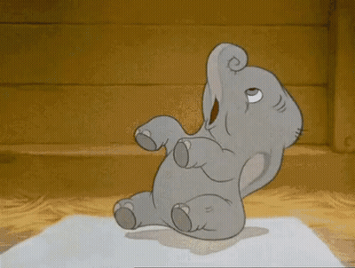 A Cartoon Elephant Is Sitting On Its Back With Its Trunk Up . GIF