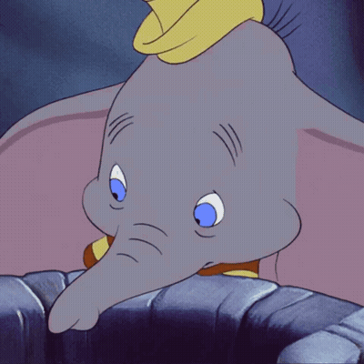 A Cartoon Elephant With Blue Eyes And A Red And Yellow Striped Shirt GIF
