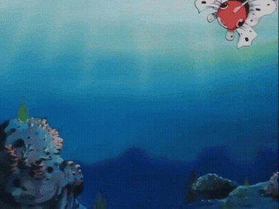 A Cartoon Fish Is Swimming In The Ocean Near Some Rocks . GIF
