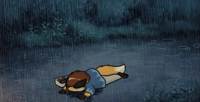 A Cartoon Fox Is Laying In The Rain GIF