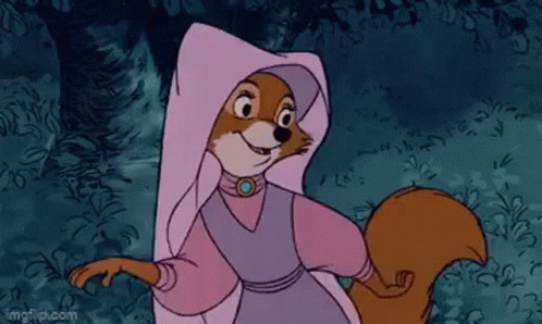 A Cartoon Fox Wearing A Pink Robe And A White Hood Is Standing In A Forest . GIF