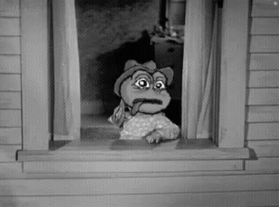 A Cartoon Frog Is Sticking Its Tongue Out Of A Window . GIF