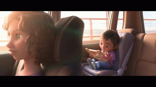 A Cartoon Girl Is Sitting In A Car Seat Looking Out The Window GIF