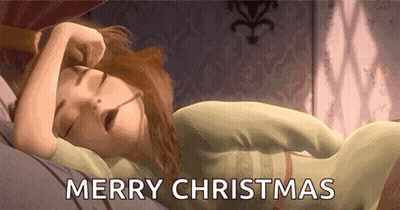 A Cartoon Girl Is Sleeping In A Bed With Her Eyes Closed And The Words `` Merry Christmas '' Written Above Her . GIF