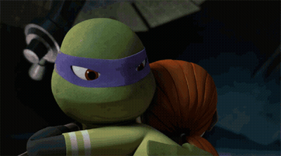 A Cartoon Girl Kissing A Turtle With A Purple Headband GIF