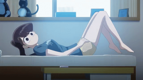 A Cartoon Girl Laying On A Bed With Her Legs Crossed GIF