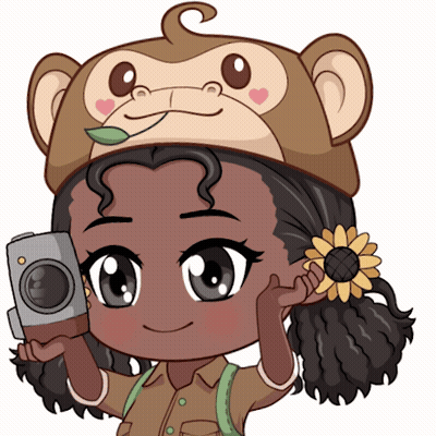 A Cartoon Girl Wearing A Monkey Hat Holding A Camera GIF