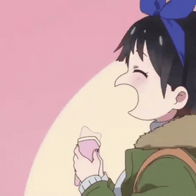 A Cartoon Girl With A Blue Bow On Her Head Is Holding A Cell Phone In Her Hand . GIF
