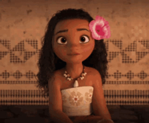 A Cartoon Girl With A Flower In Her Hair Is Sitting Down GIF